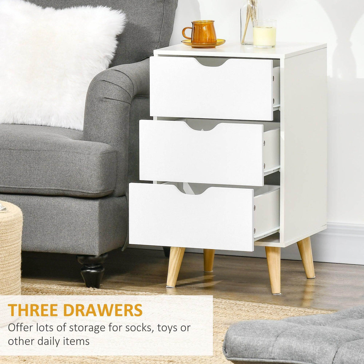 White 3-drawer dresser with black curved handles and side open storage cabinet