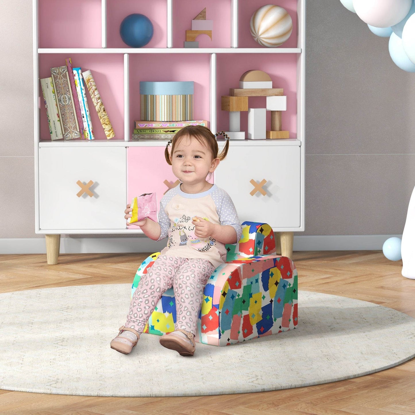 Colorful foldable toddler armchair with soft padded sponge seat, front view.