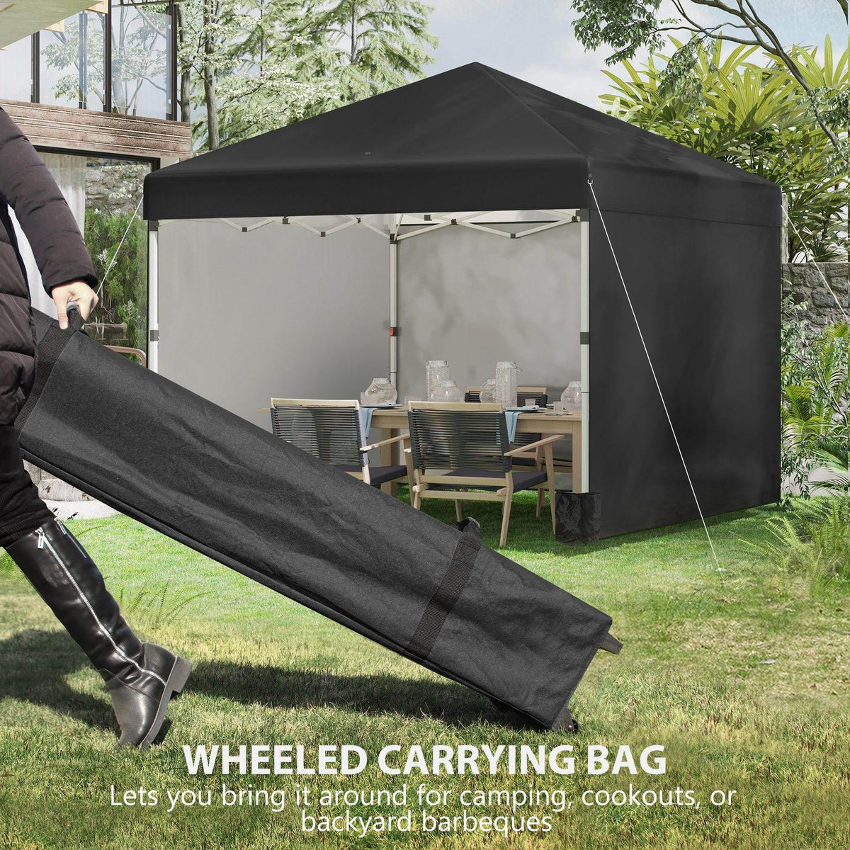 Black pop-up gazebo with wheeled carrying bag laid out on the lawn