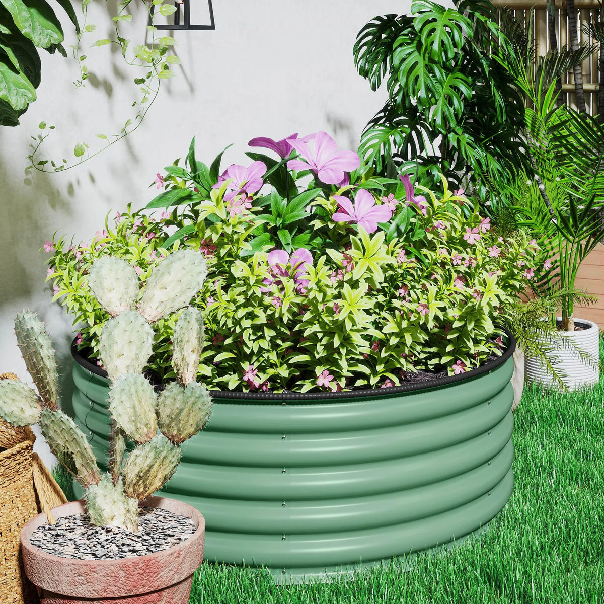 Light green round raised garden bed with mixed plants and pink flowers in yard