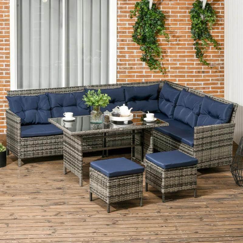 Outdoor patio wicker sofa set with navy cushions and glass table