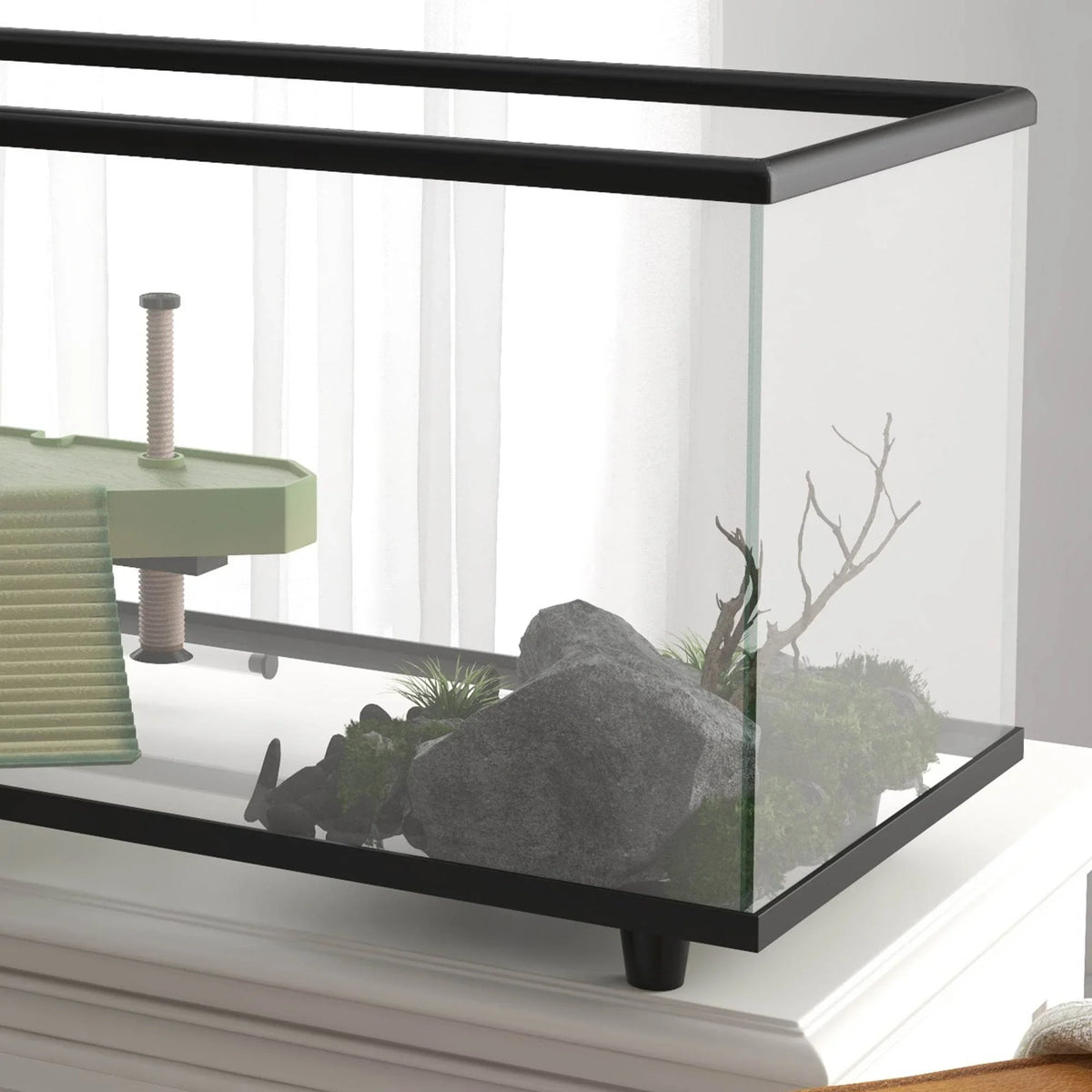 Glass turtle aquarium with black frame, basking area and rocks inside