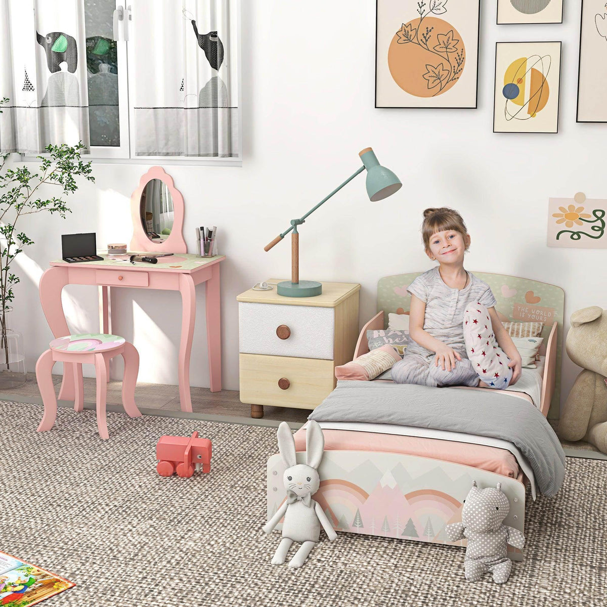 Pink kids bed frame and dressing table set with mirror, drawers, and animal accents