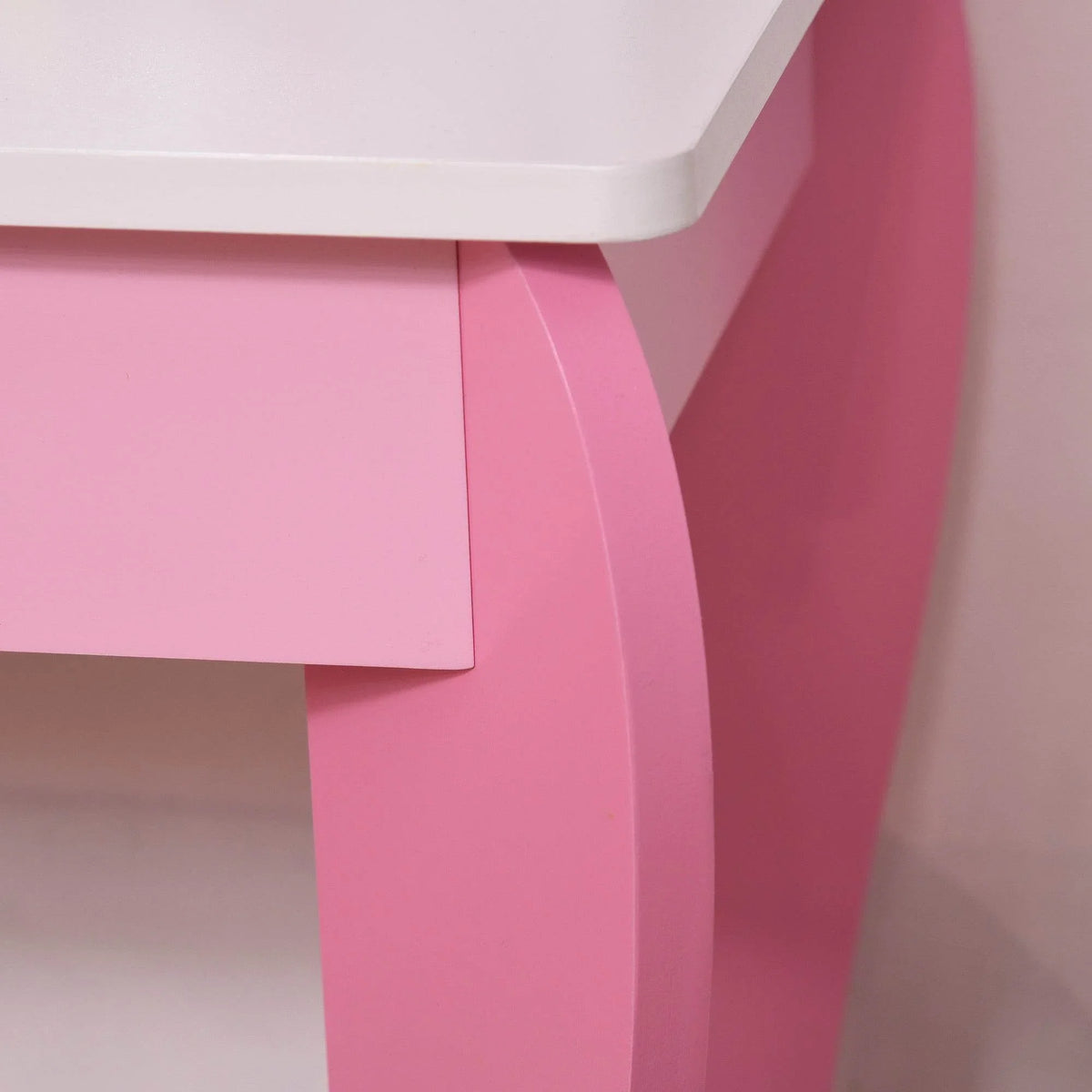 Pink-and-white vanity table legs with front drawer under the tabletop