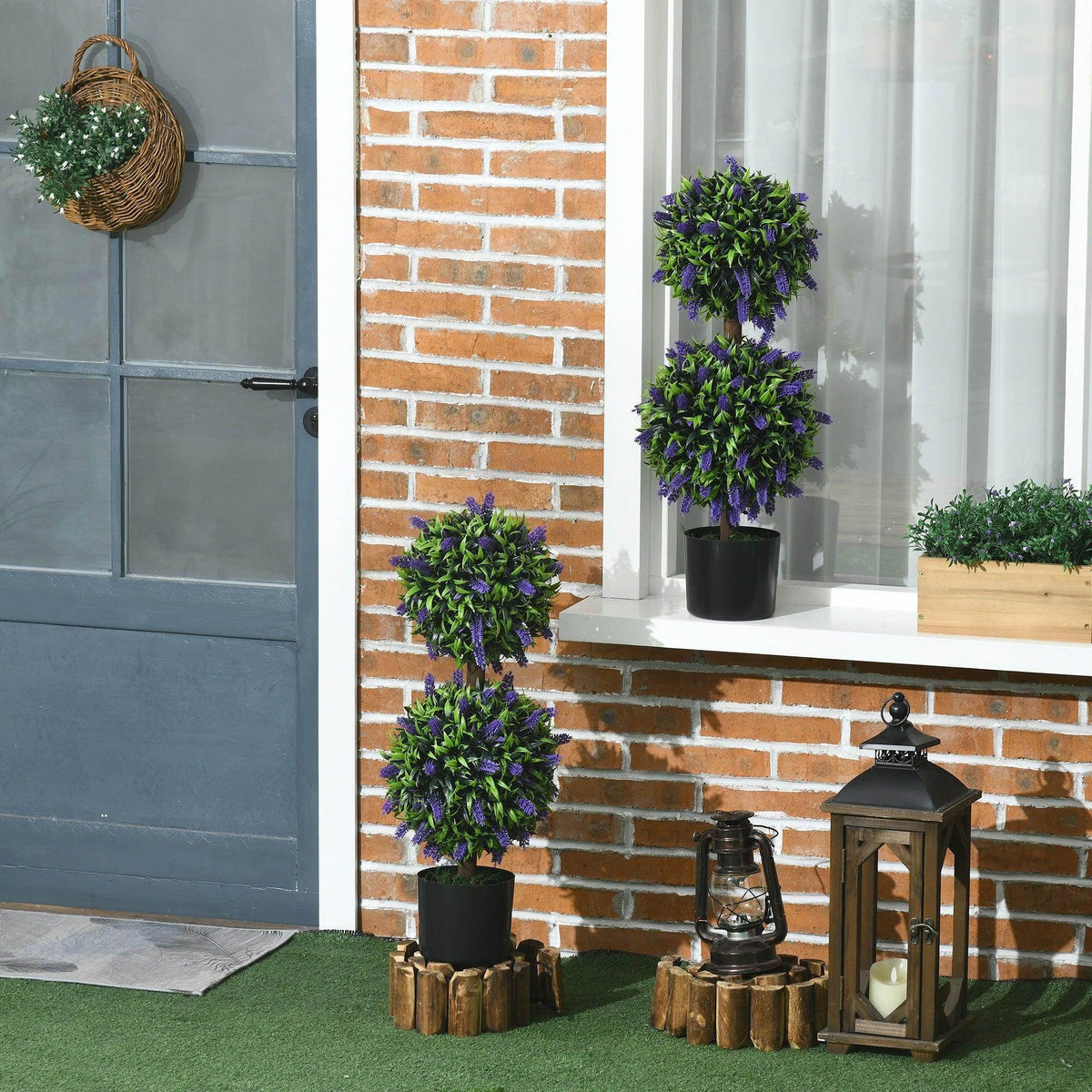 Set of 2 artificial potted ball tree plants with purple flowers in black pots