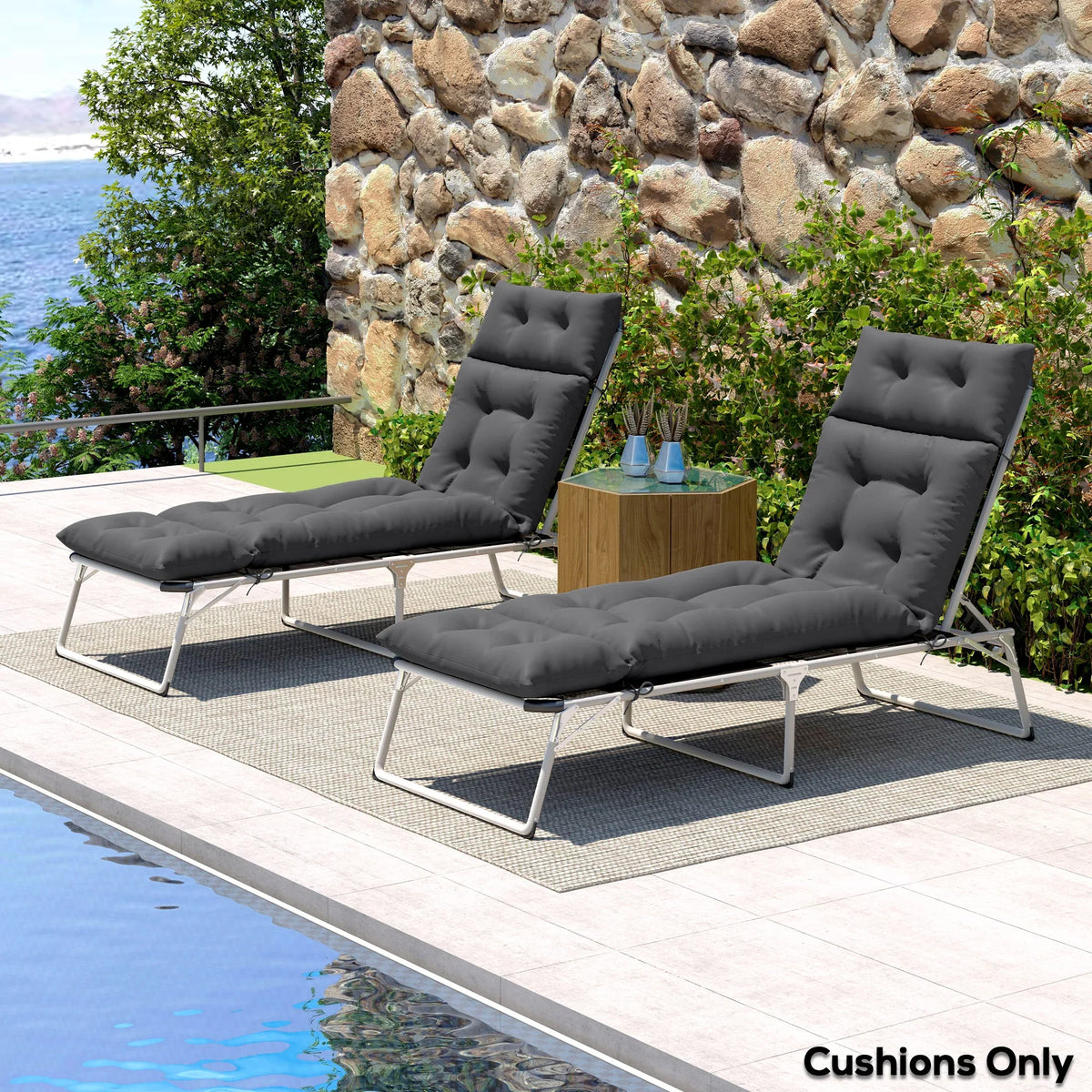 Pair of dark grey sun lounger cushions on metal loungers with attached tie points