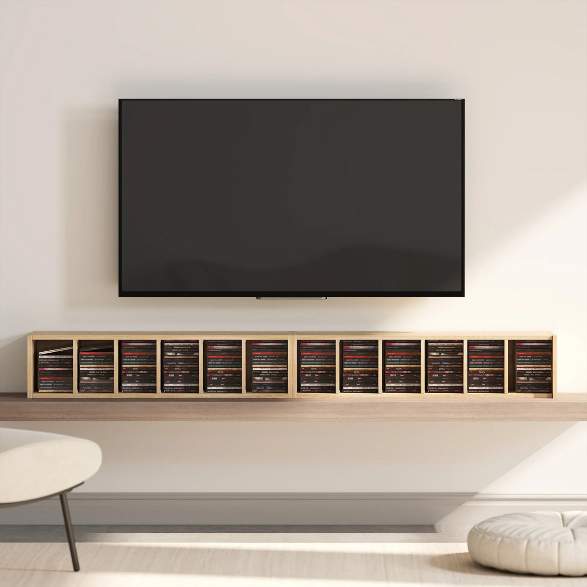 Wall-mounted CD media display shelf with long row of media spines