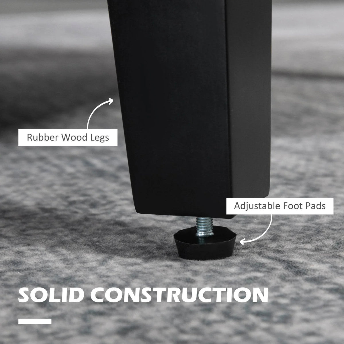 Rubber wood legs with adjustable foot pads on a grey upholstered armchair