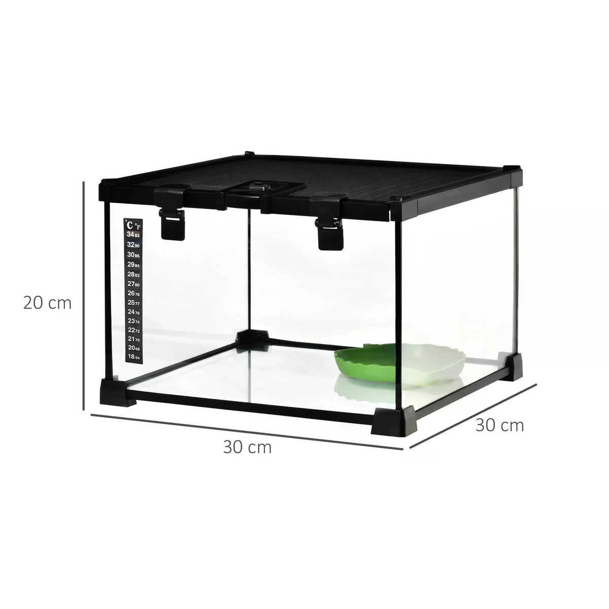 Black glass reptile terrarium with green water dish and side thermometer strip
