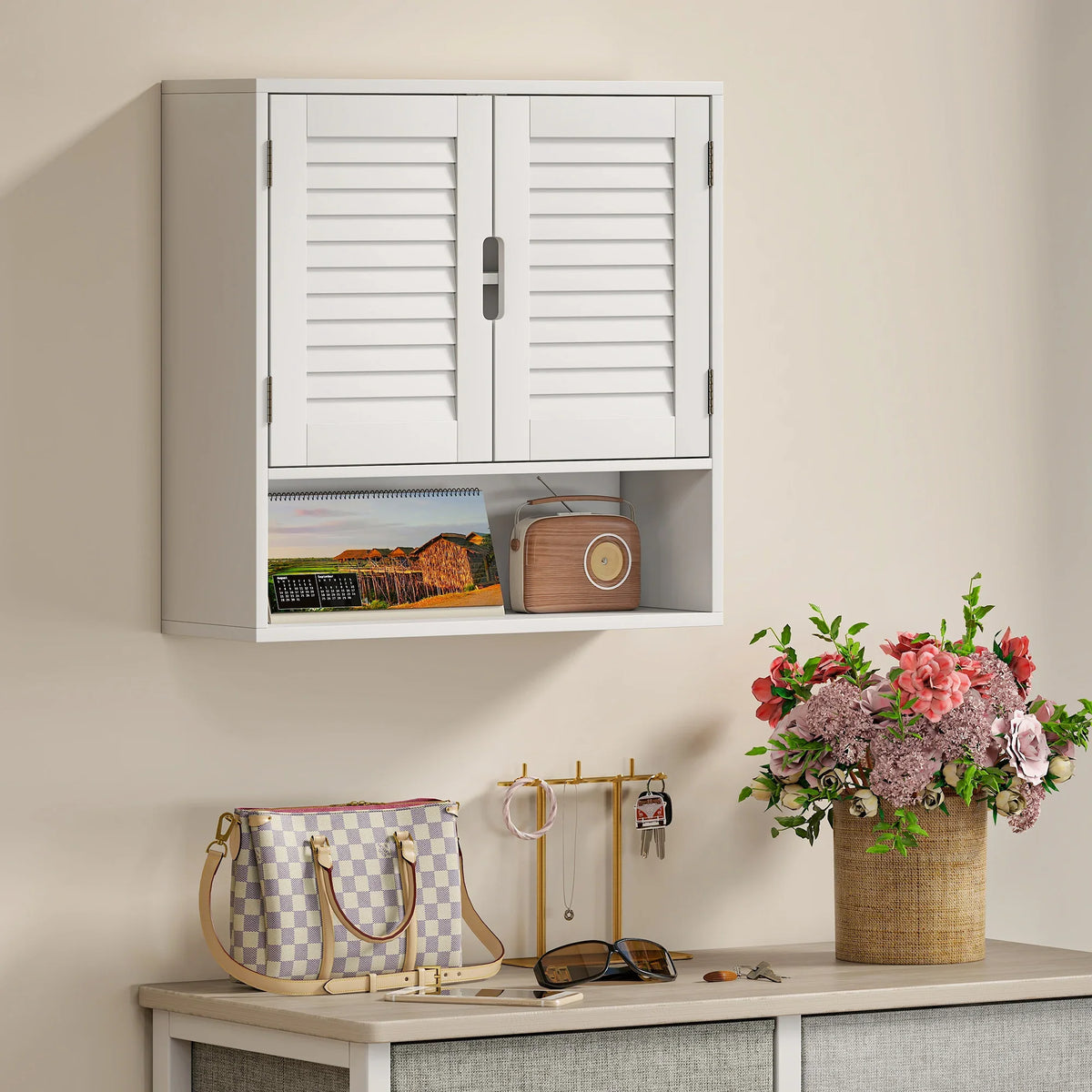 White wall cabinet with louvered doors, open shelf and hanging storage compartments