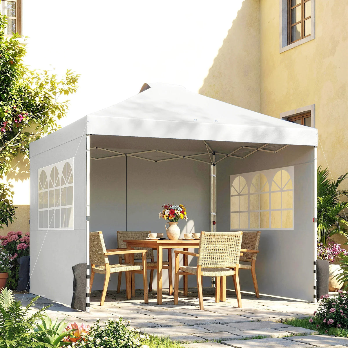White pop-up gazebo with waterproof canopy and windowed side panels, open front view