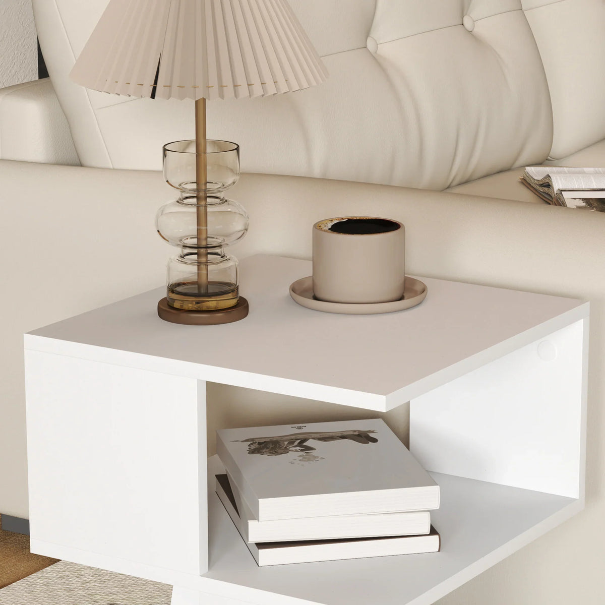White square side table with open cubby shelf and wide tabletop, styled with decor.