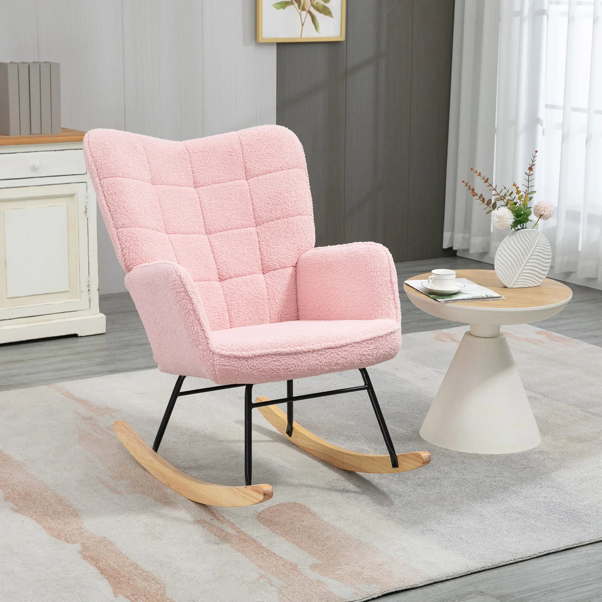 Pink plush wingback rocking chair with high back and armrests, quilted fabric