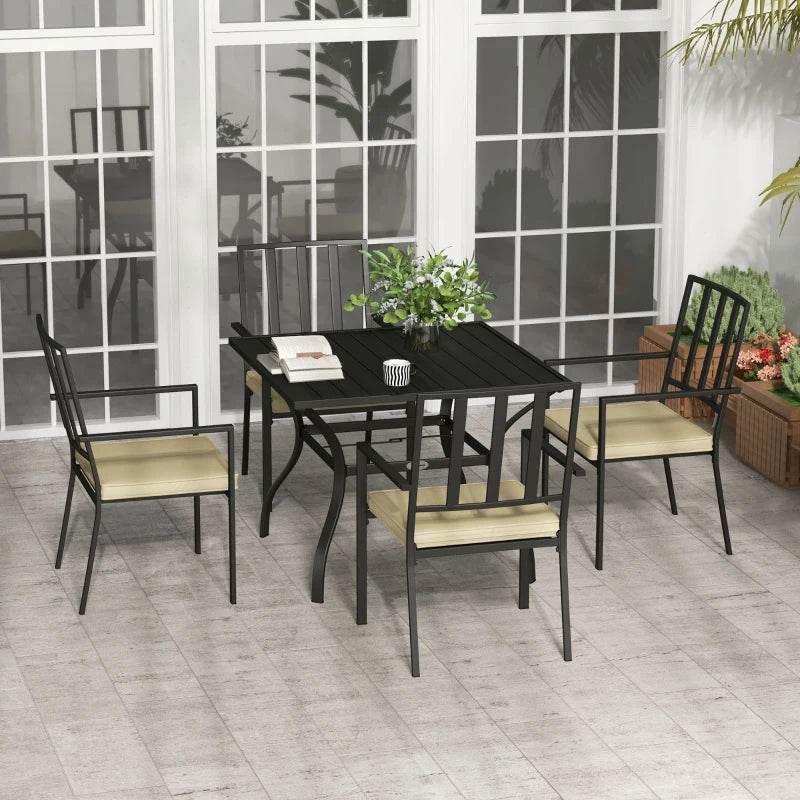 Outdoor dining table with four stackable chairs, black metal frame, beige seat cushions