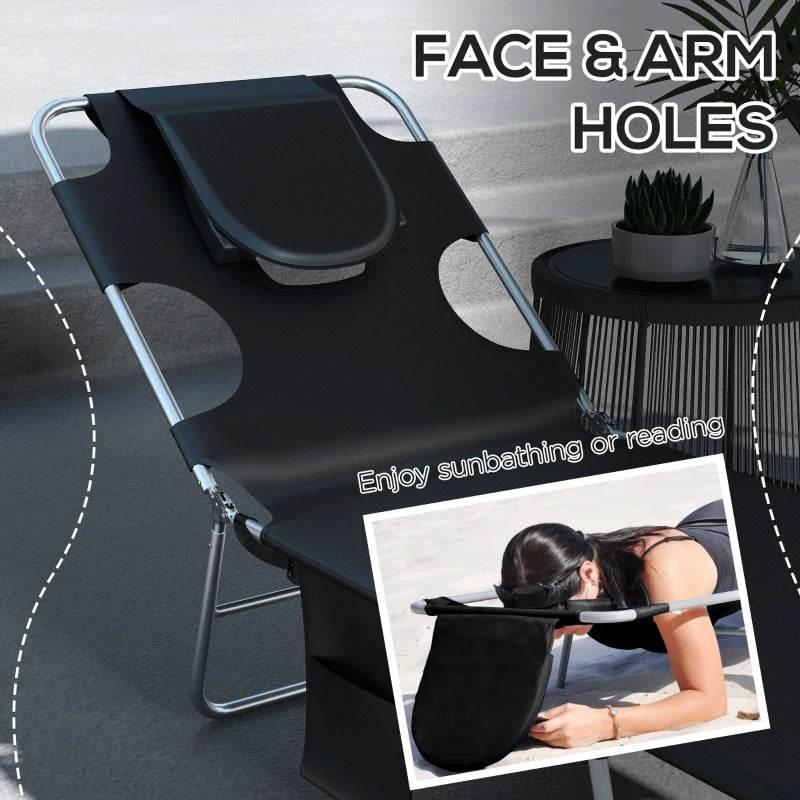 Black sun lounger with face and arm holes and curved head pillow