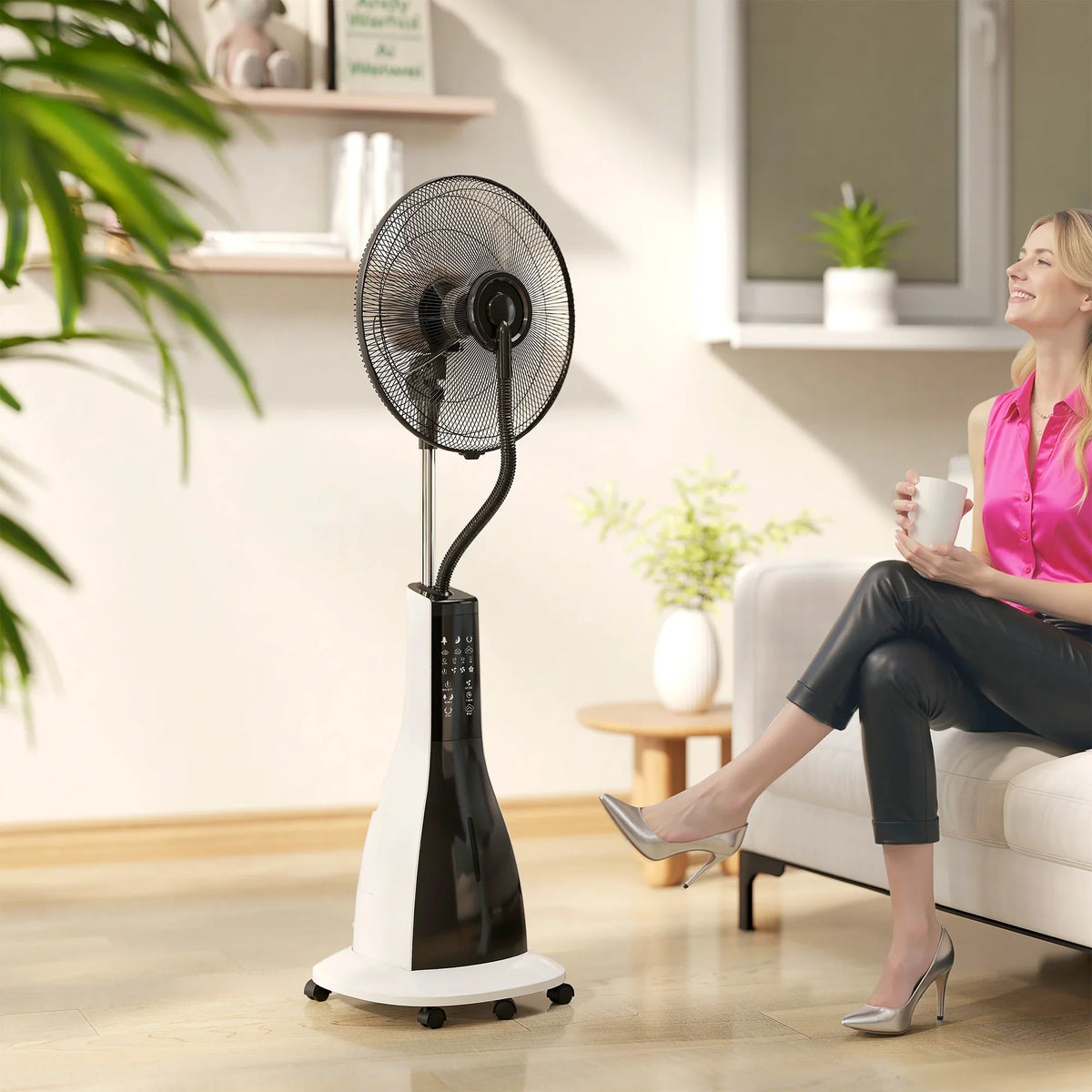 Black pedestal misting fan with mist spray, remote control, and oscillating head