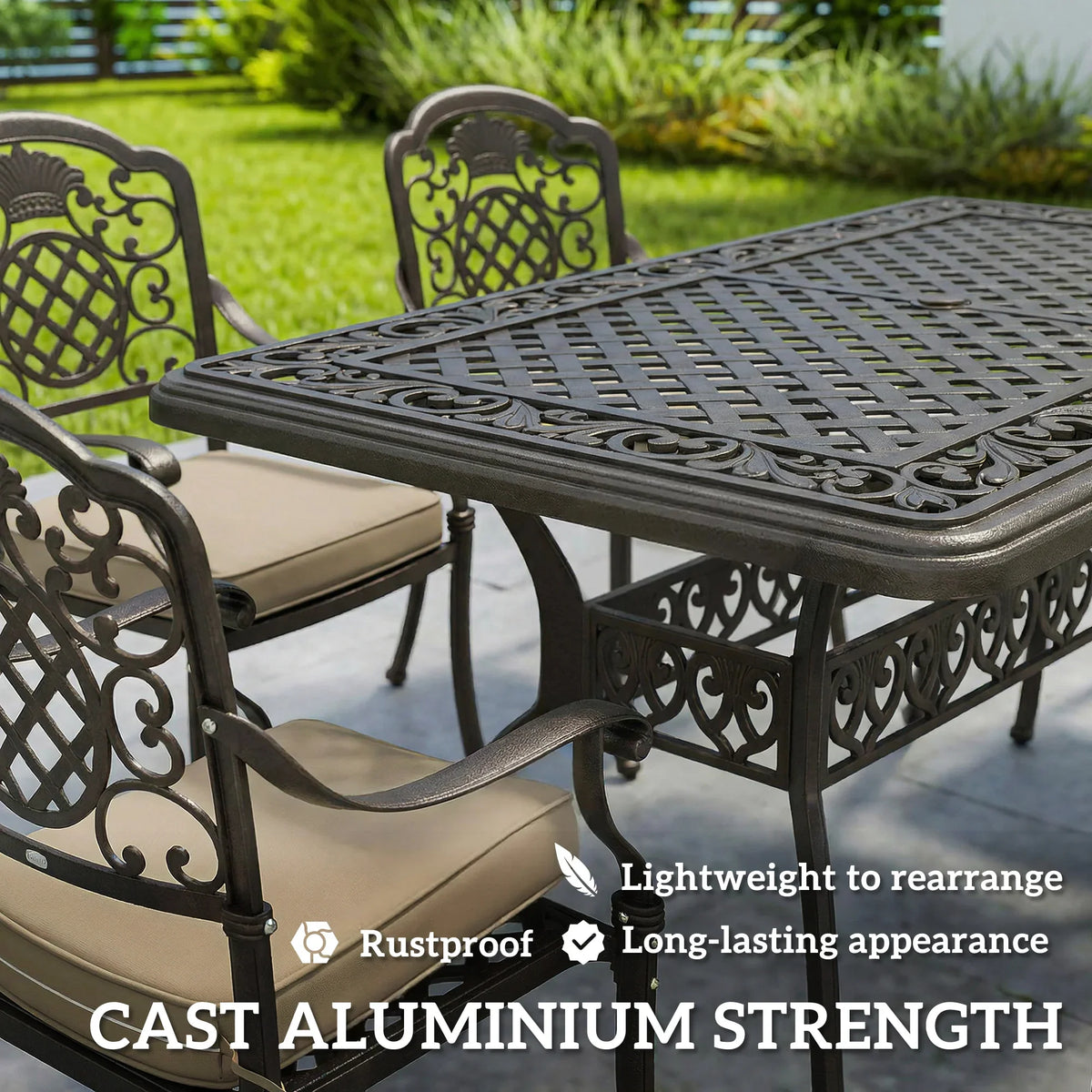 Bronze cast aluminum dining table with ornate legs and cushioned chairs in beige