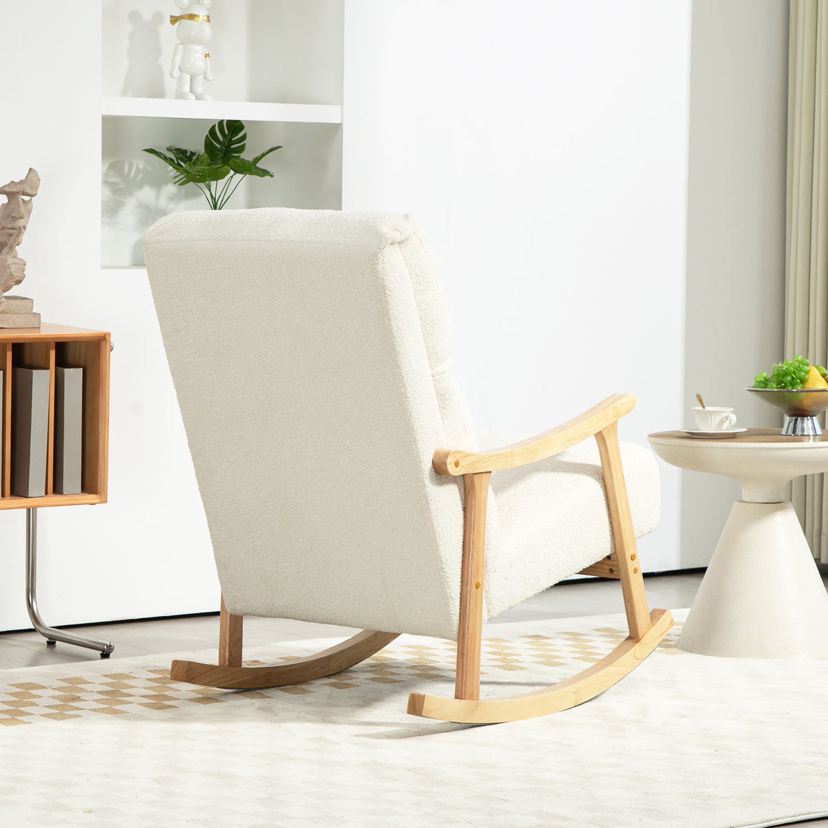 Cream teddy-fleece nursing rocking chair in rear three-quarter view with wooden rockers