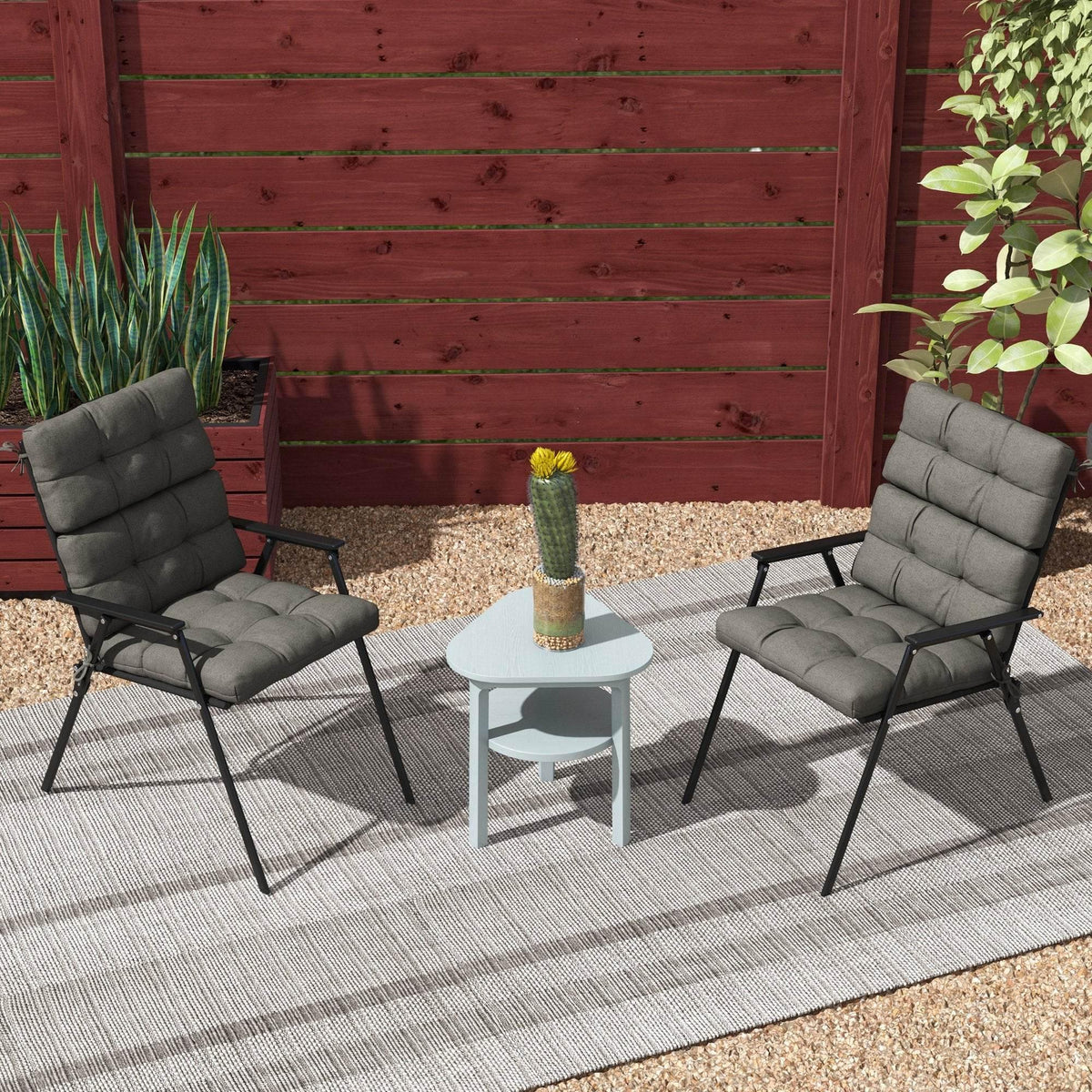 Charcoal grey outdoor chair cushion set with backrest and seat pads on two chairs