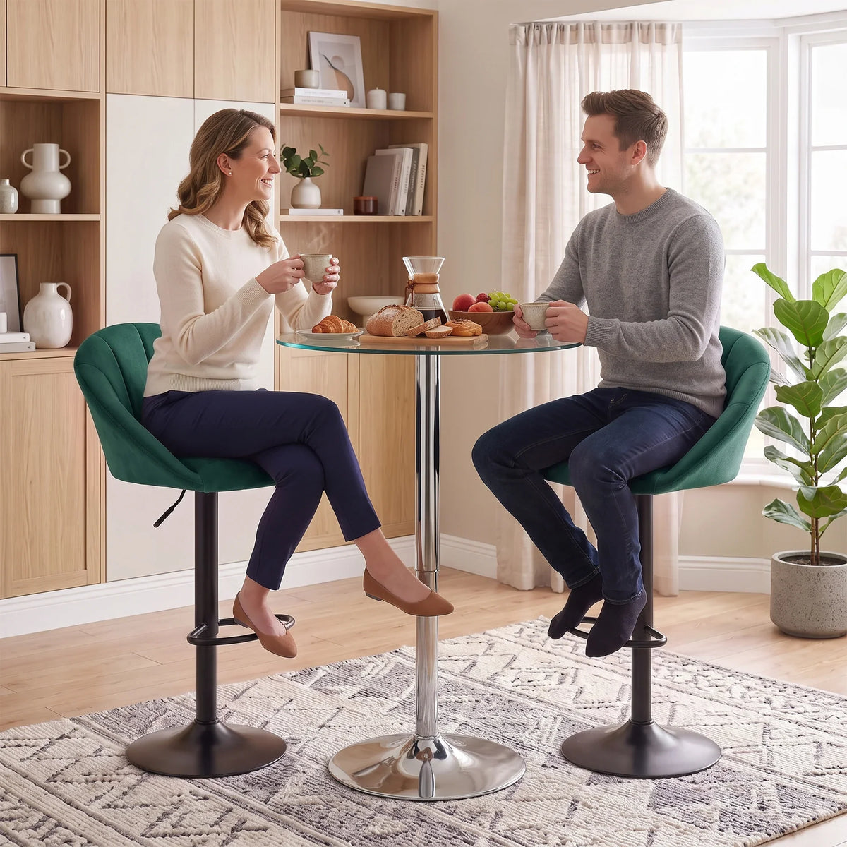 Dark green velvet bar stools with swivel bases and curved backrests