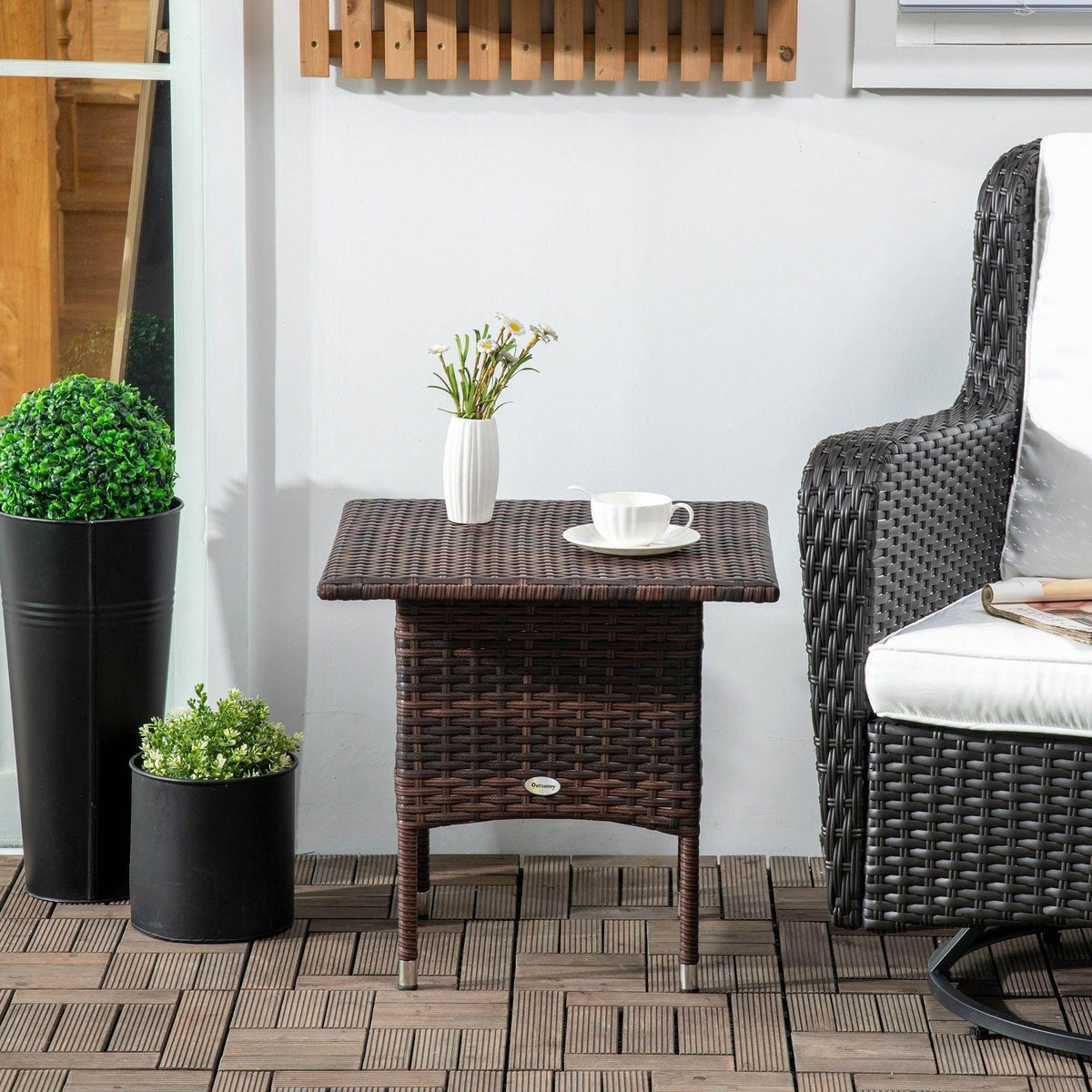 Outdoor patio side table with dark brown woven tabletop and cabinet-style sides