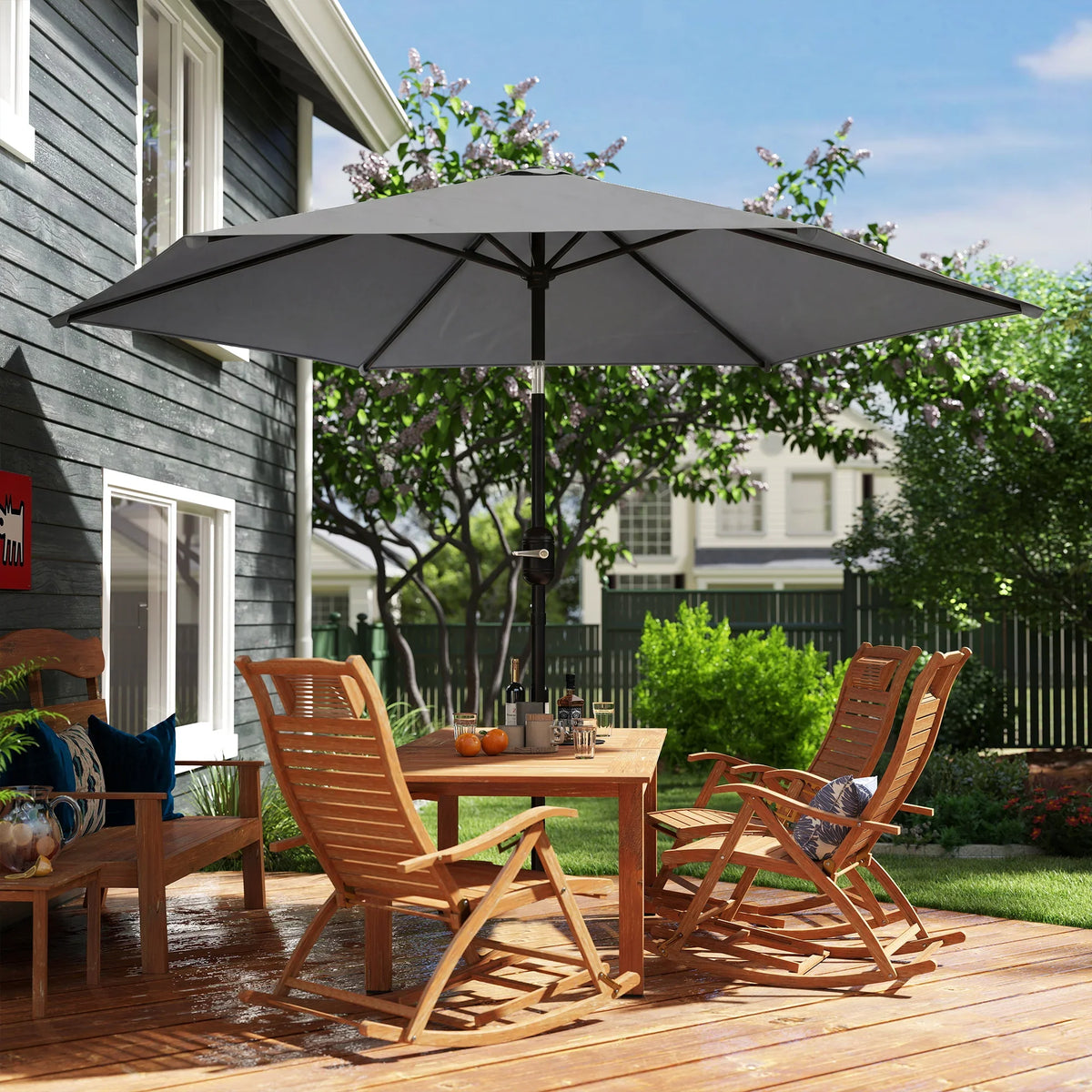 Grey patio parasol umbrella open, supported by a central pole