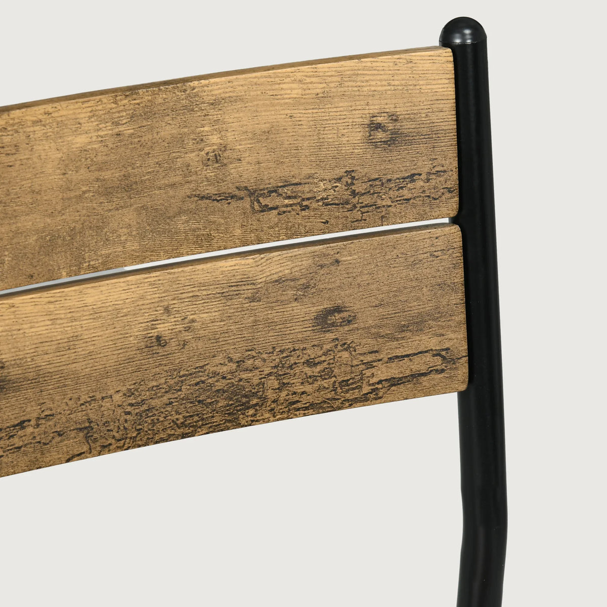 Close-up of chair back panel in rustic brown with black metal frame