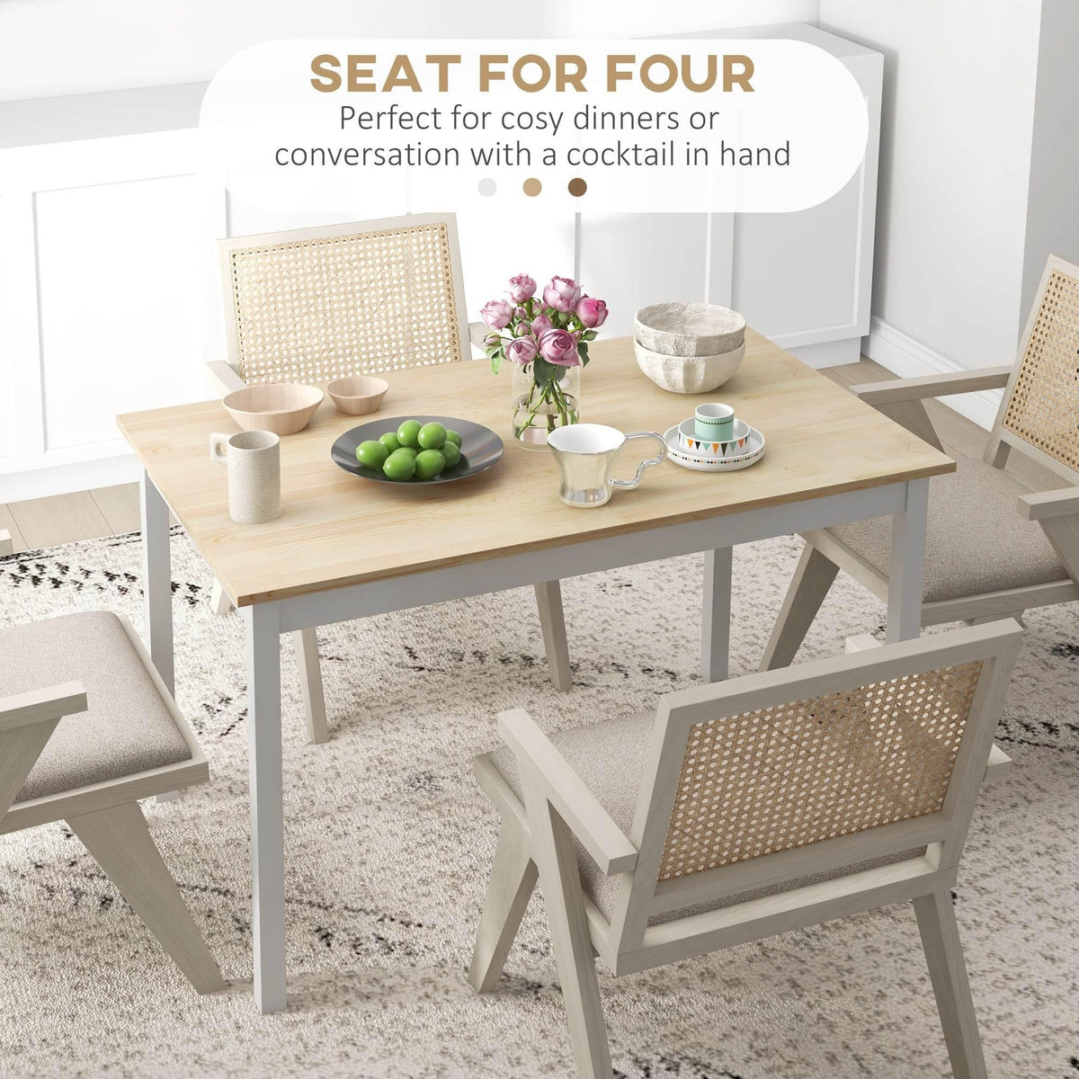 Farmhouse-style dining table with light pine top and white frame, set with dinnerware