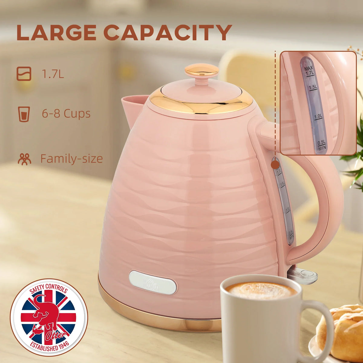 Pink electric kettle with water level window on handle and gold-trim base on counter