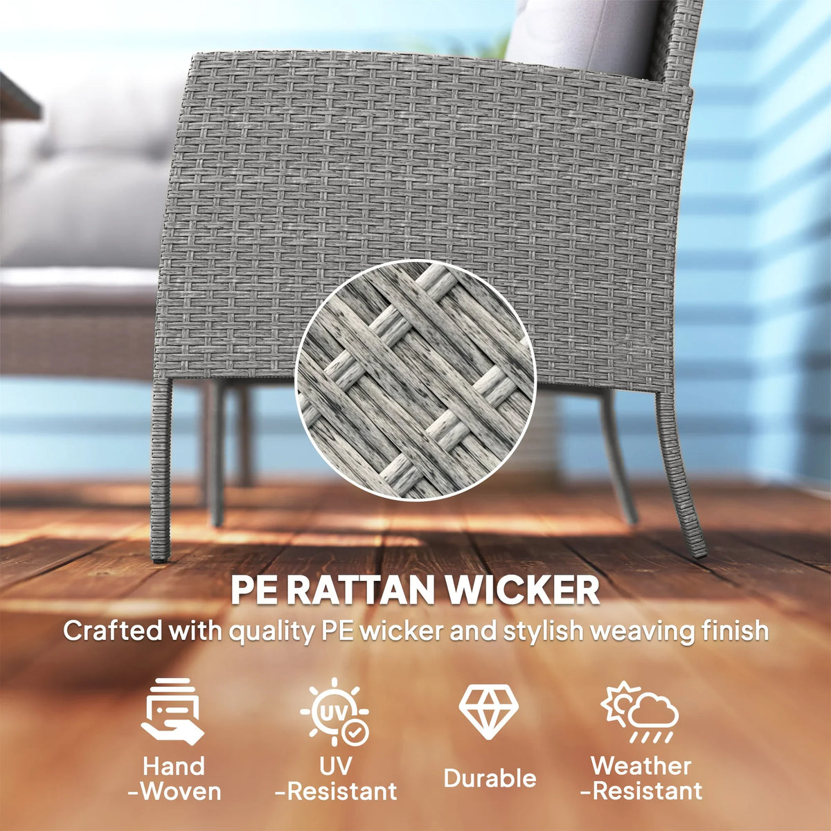 Grey rattan armchair back with woven PE wicker texture and curved arms