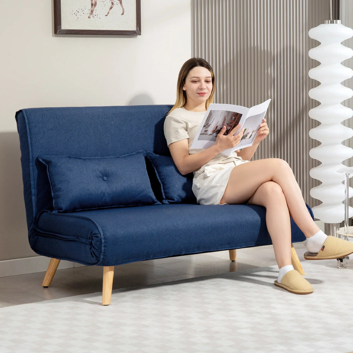 HOMCOM dark blue two-seat sofa bed with tufted cushions and wooden legs