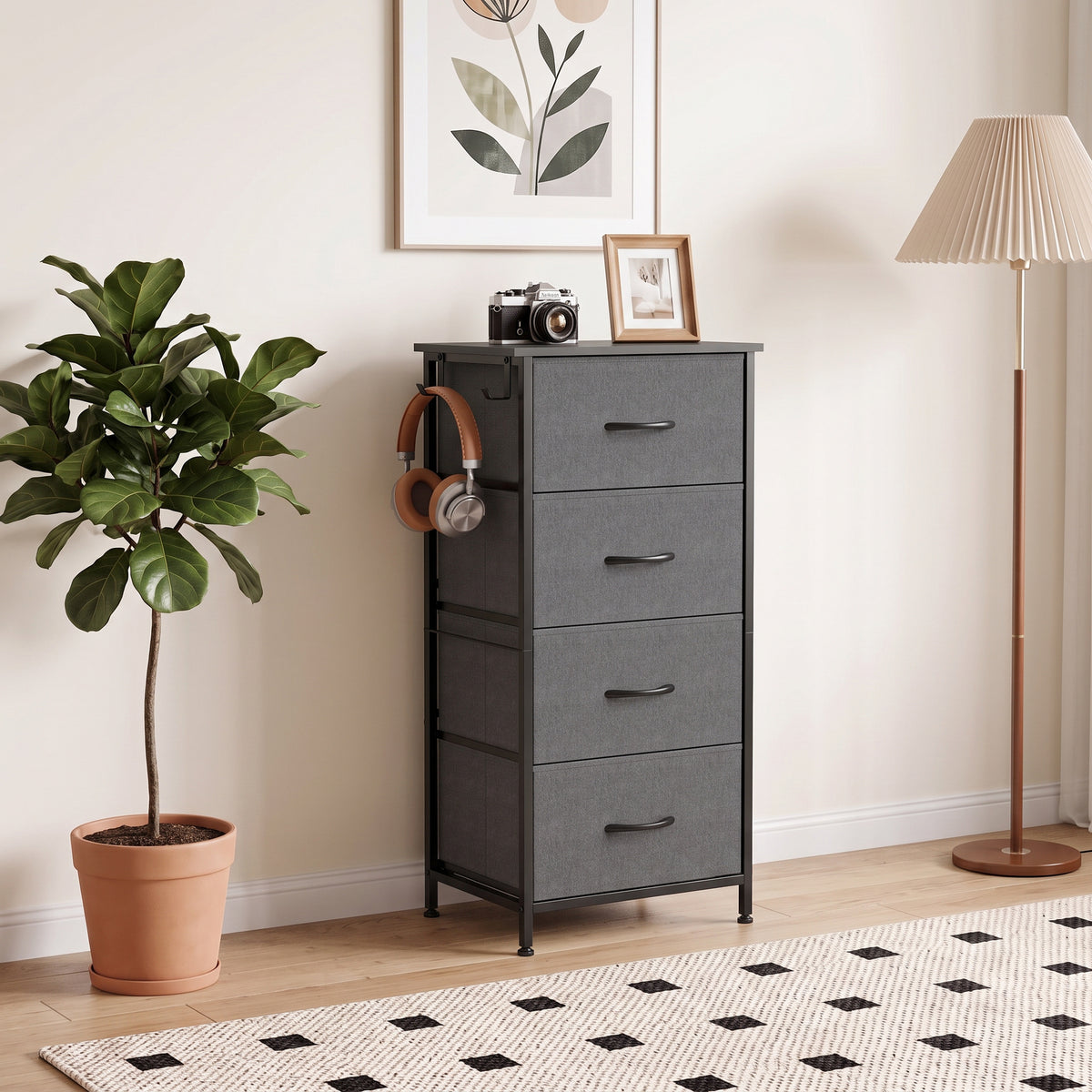 Grey fabric dresser standing in a room with four drawers and a metal frame base