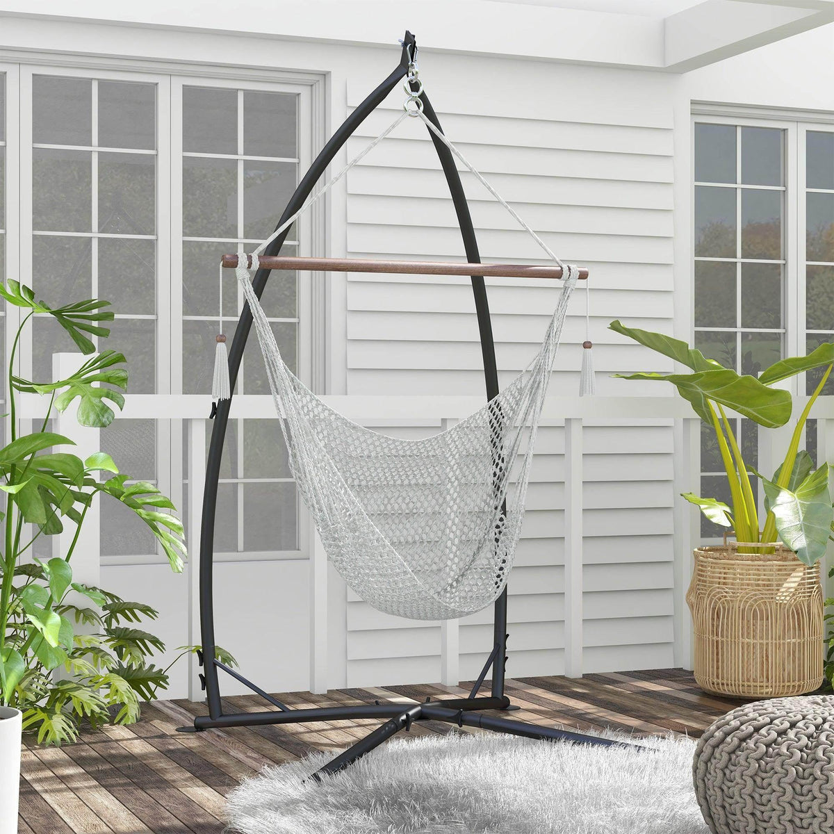 Black metal hammock chair stand with curved legs and hanging chain support frame