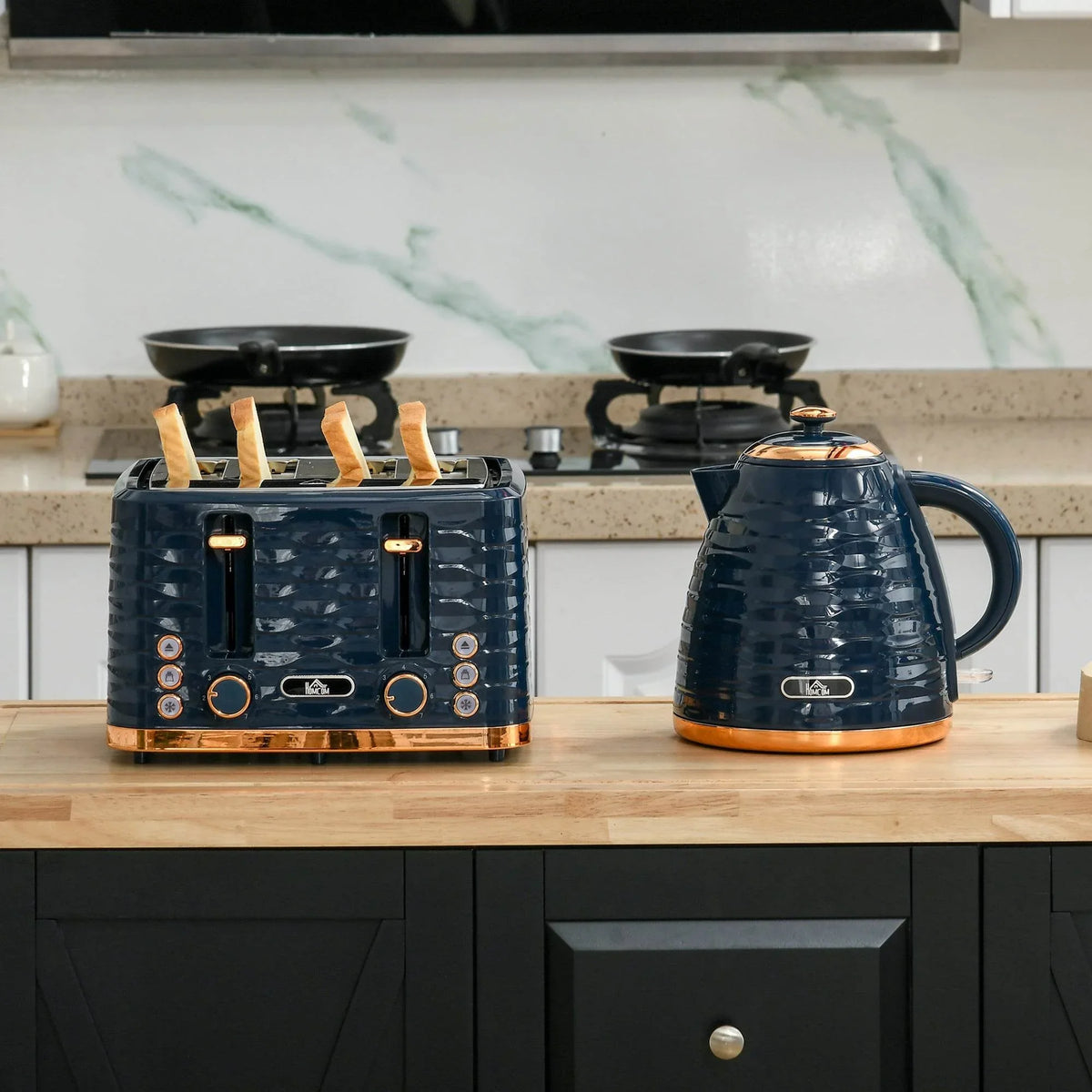 Kettle and toaster set on countertop, glossy dark blue with gold accents
