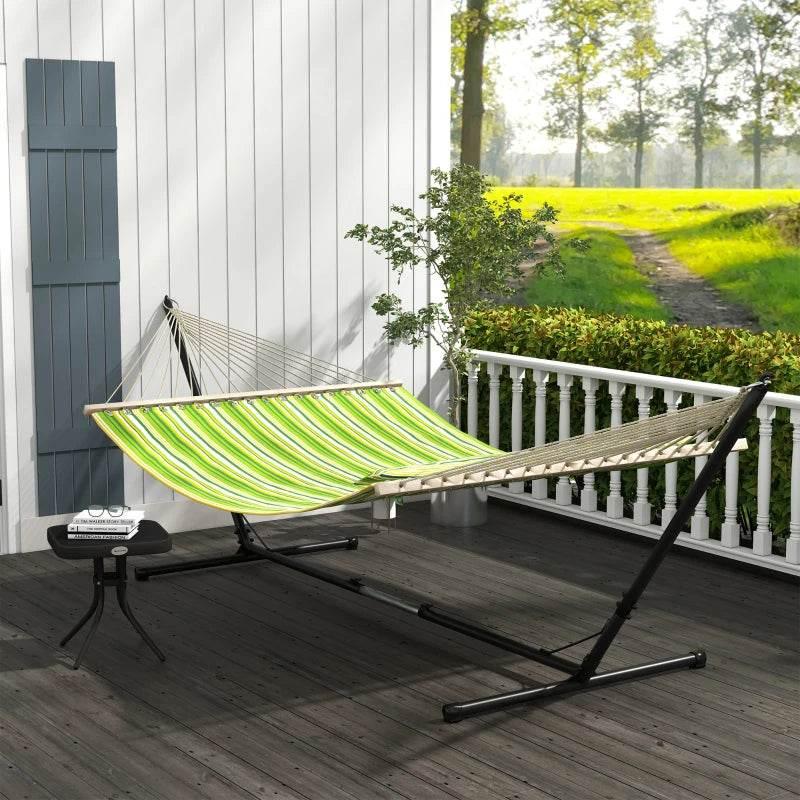Green striped cotton double hammock on black adjustable steel stand with spreader bar