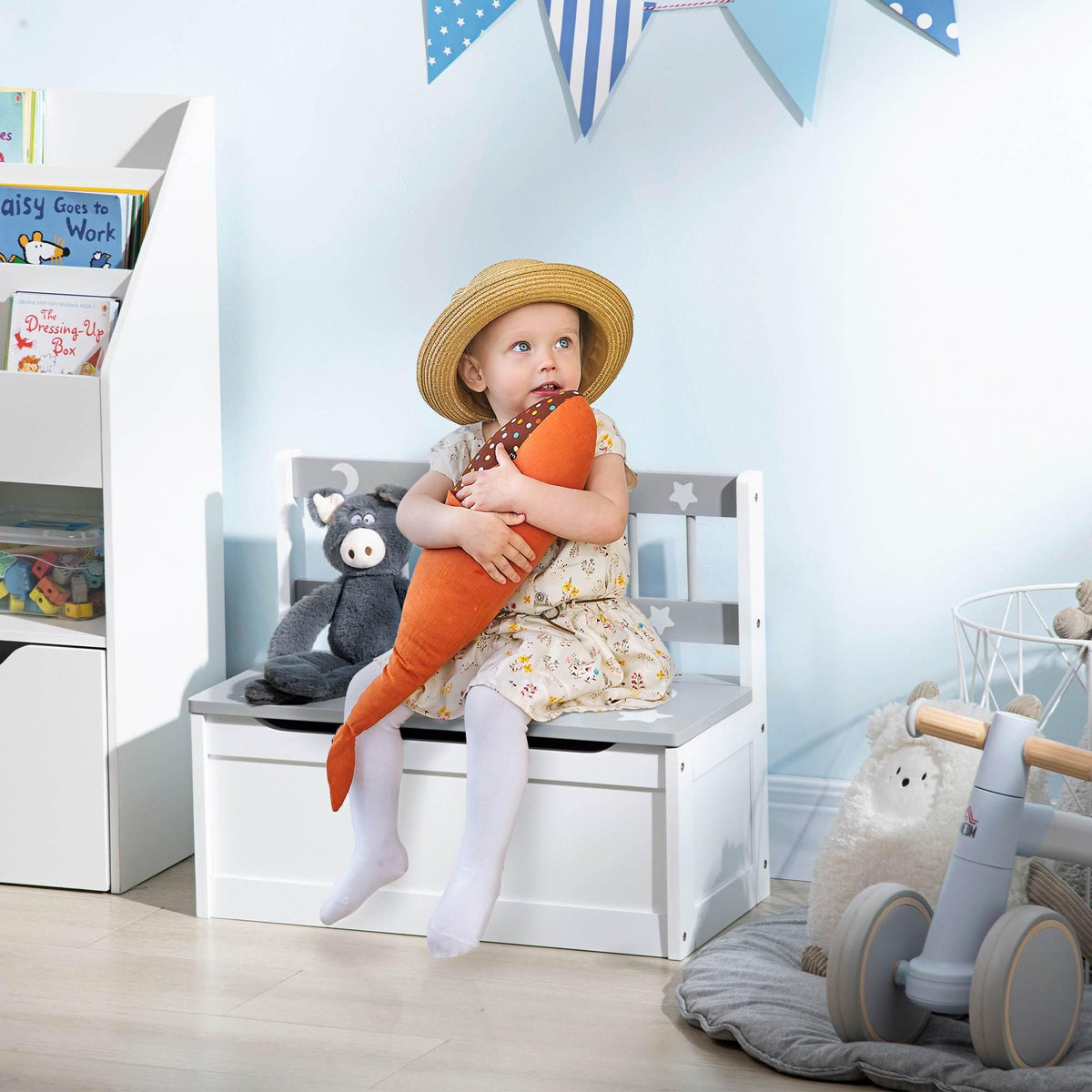 Kids storage bench and toy chest with grey star-and-moon lid, white frame.