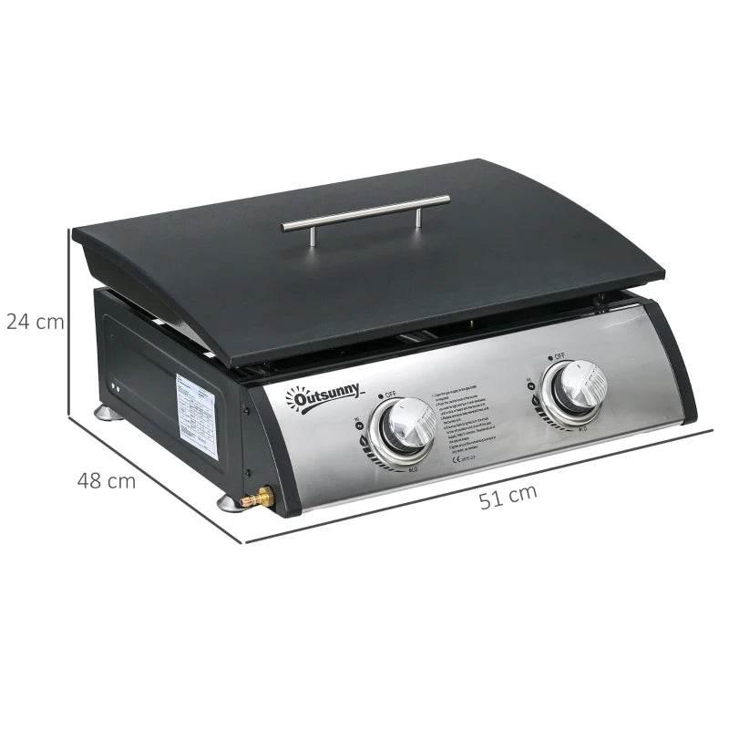 Compact gas plancha grill with black griddle lid and two front burner control knobs