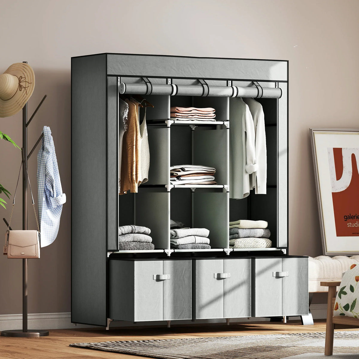Foldable fabric wardrobe with dark frame, hanging rail, shelves, and 3 drawer fronts