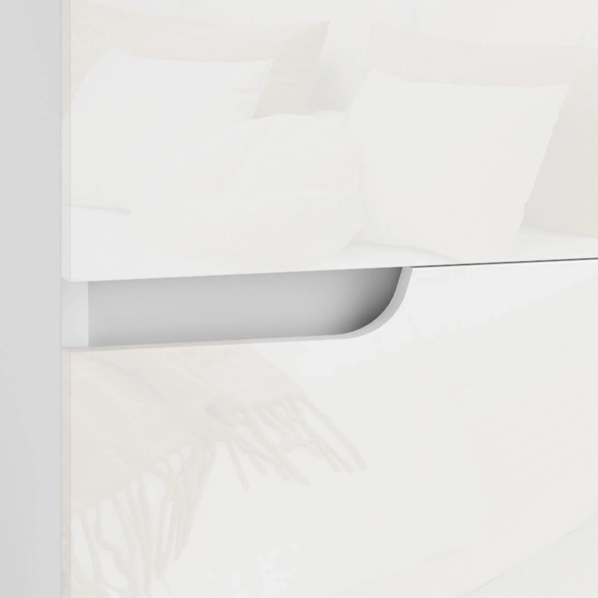 Close-up of a white high-gloss nightstand drawer with smooth pull track