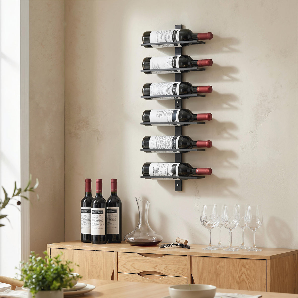 Wall-mounted 6-tier metal wine rack with multiple wine bottles and glassware