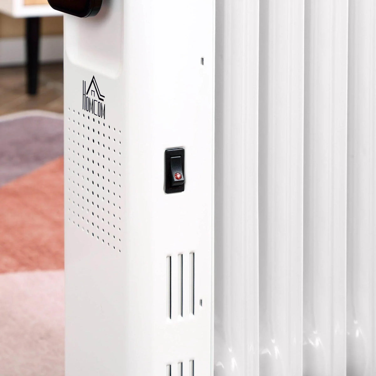 White oil-filled radiator side panel with brand logo and small power button