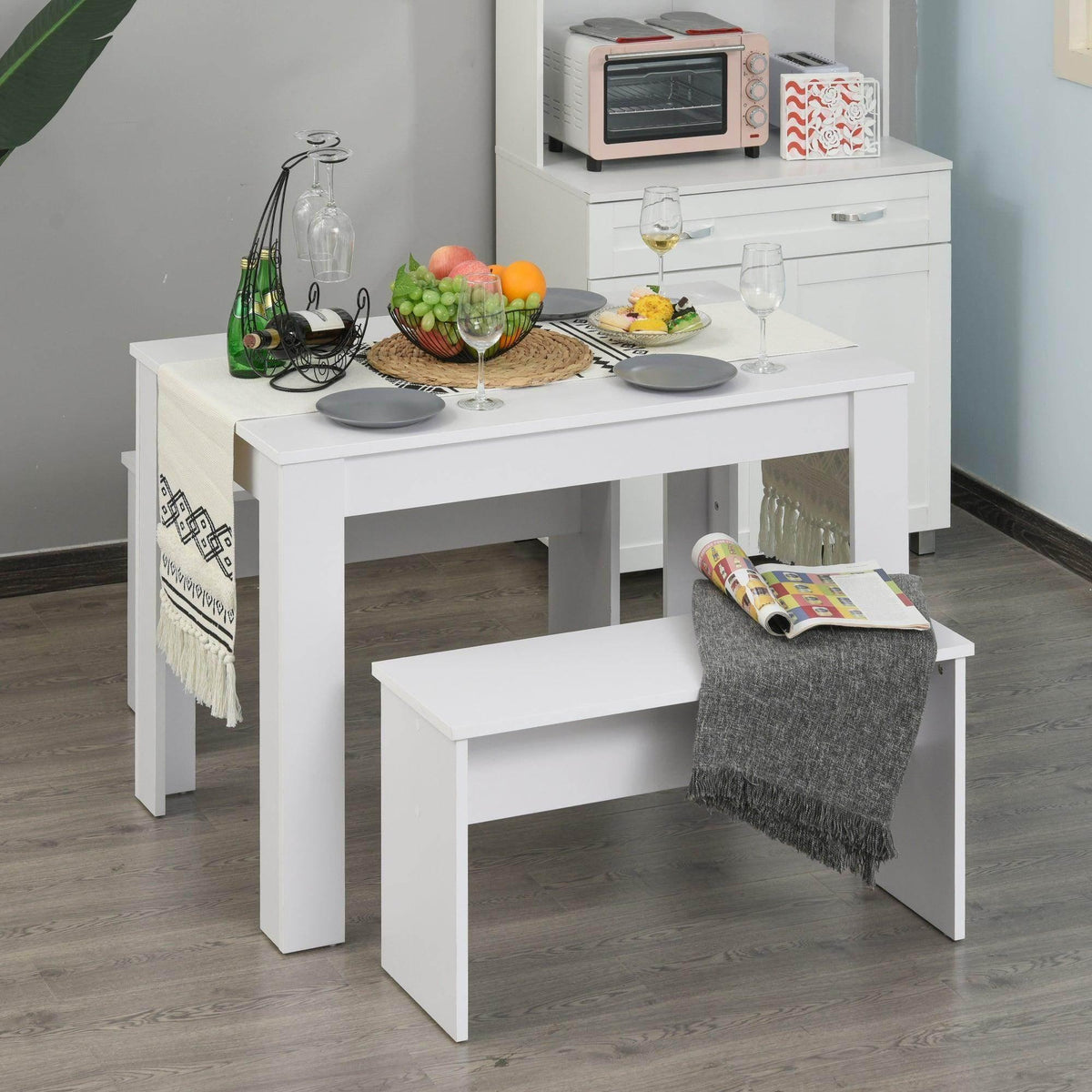 White dining table with two benches, compact space-saving design