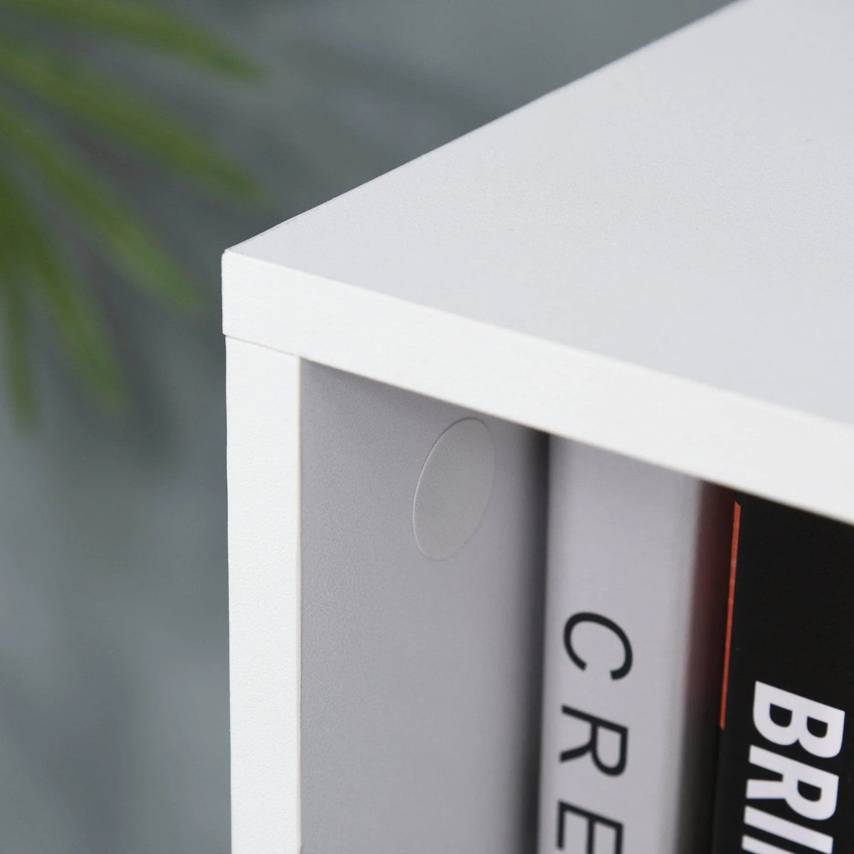 Close-up of white storage cube organizer corner with molded handle detail