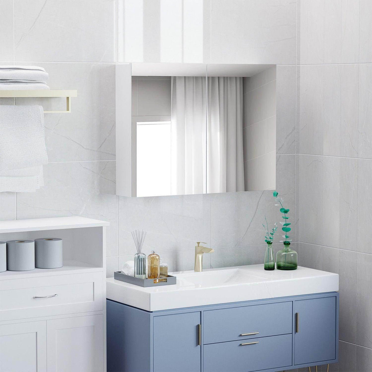 Wall-mounted bathroom mirror cabinet next to a countertop with cabinet doors