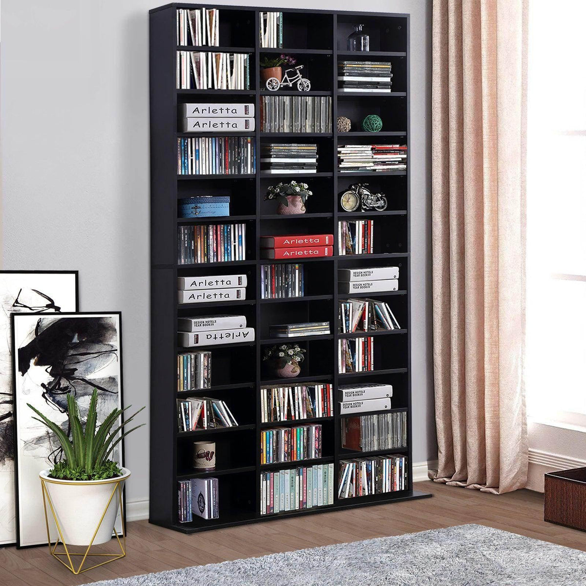 Black CD/DVD storage cabinet with multiple open compartments for books and media