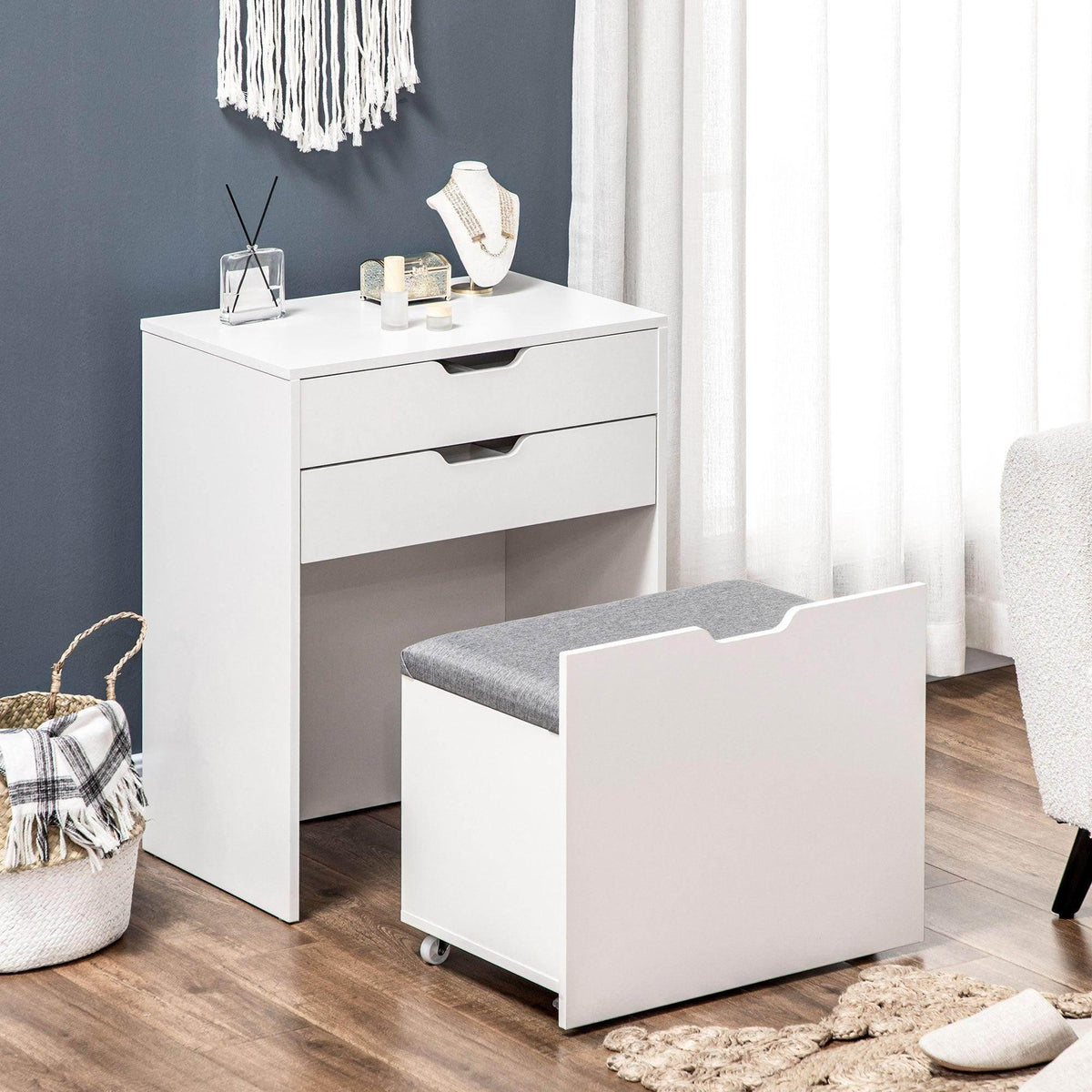 White vanity table with two drawers and flip-up mirror, paired with gray stool