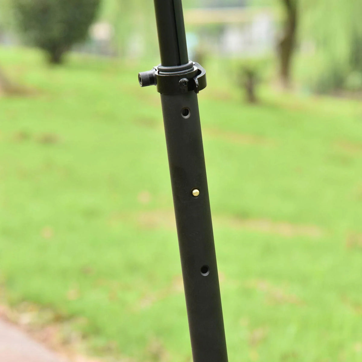 Adjustable black scooter handlebar post with clamp and gold pin detail