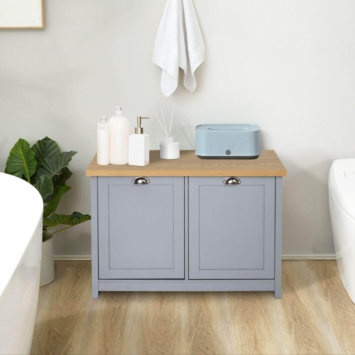 Grey shoe cabinet with two doors, wooden top, and round metal knobs
