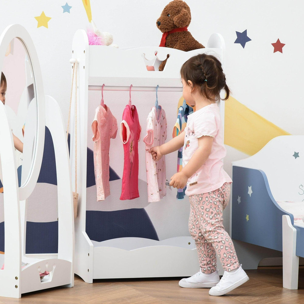 White kids wooden clothes rack with hanging bar and open storage shelves for toddlers