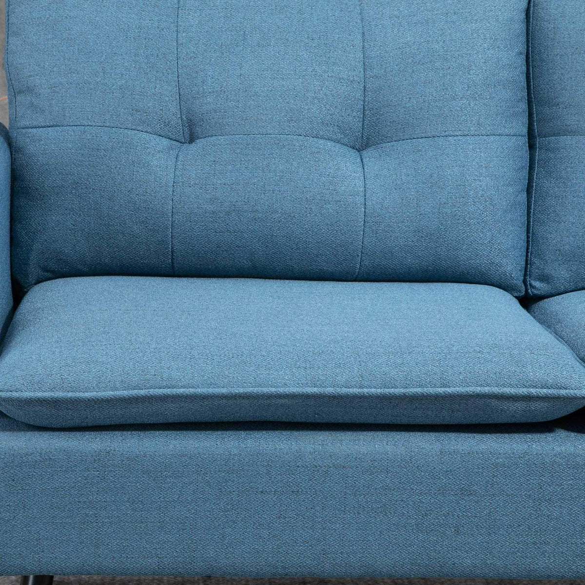Dark blue upholstered seat cushion with tufted back panel and padded armrest